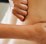 1 a woman being a model on deep tissue massage course