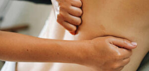 1 a woman being a model on deep tissue massage course