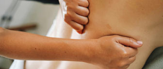 1 a woman being a model on deep tissue massage course